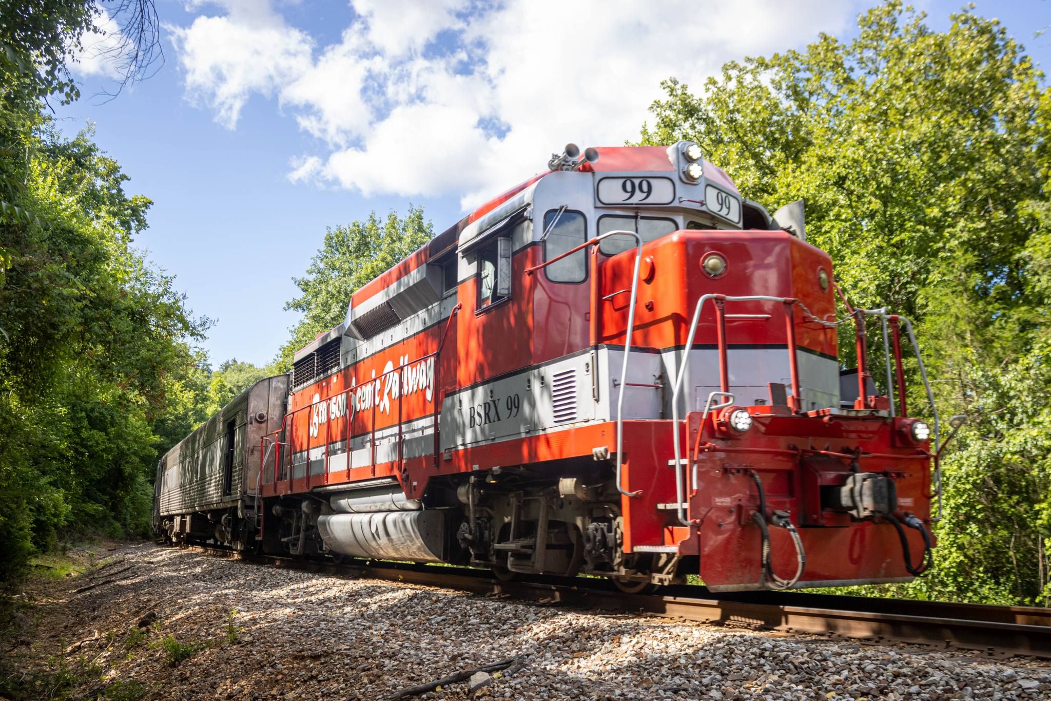 Branson Scenic Railway diesel locomotive with lush greenery